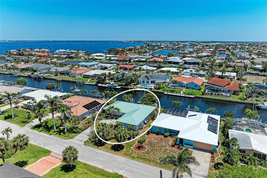 aerial view with a water view and a residential view
