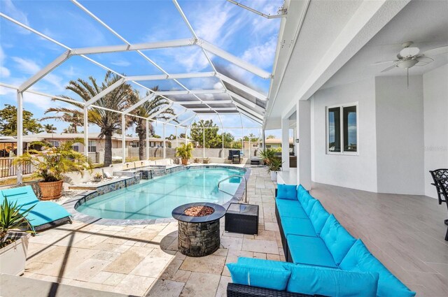4213 Gardner Dr, Port Charlotte, FL 33952 - view of pool with an outdoor living space, a patio, a pool with connected hot tub, a ceiling fan, and glass enclosure
