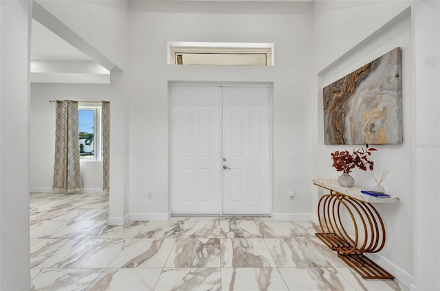 4213 Gardner Dr, Port Charlotte, FL 33952 - foyer with marble finish flooring and baseboards