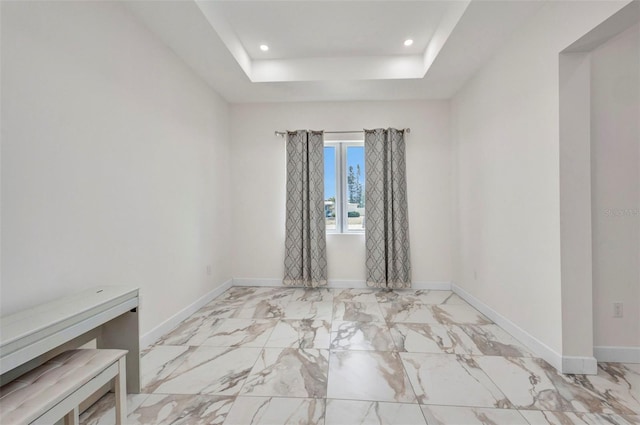 4213 Gardner Dr, Port Charlotte, FL 33952 - spare room with recessed lighting, baseboards, marble finish floors, and a tray ceiling