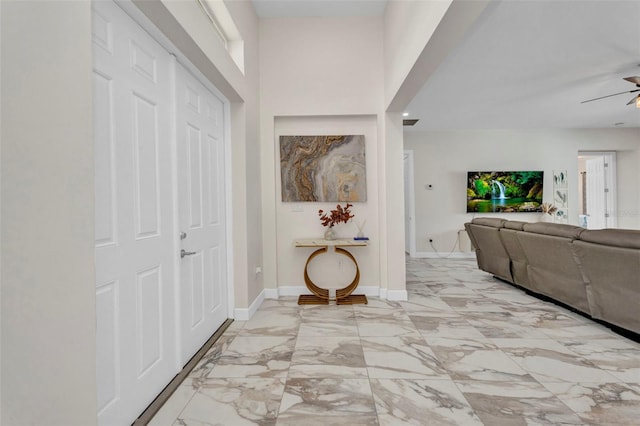 4213 Gardner Dr, Port Charlotte, FL 33952 - entrance foyer with a ceiling fan, baseboards, and light marble finish flooring
