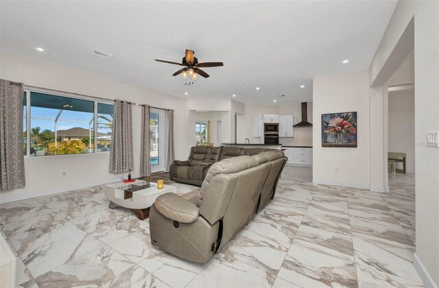 4213 Gardner Dr, Port Charlotte, FL 33952 - living area featuring light marble finish flooring, baseboards, ceiling fan, and recessed lighting