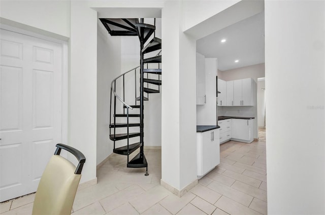 4213 Gardner Dr, Port Charlotte, FL 33952 - staircase with baseboards, tile patterned flooring, and recessed lighting