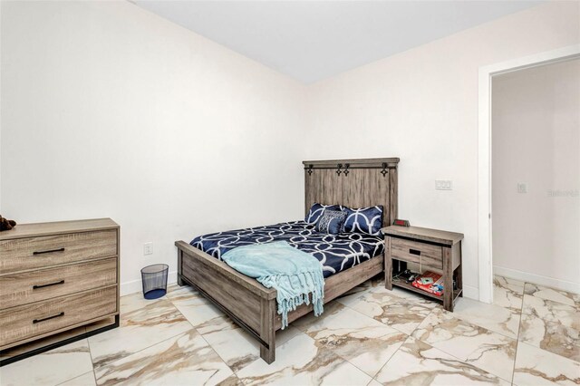 4213 Gardner Dr, Port Charlotte, FL 33952 - bedroom with marble finish floors and baseboards