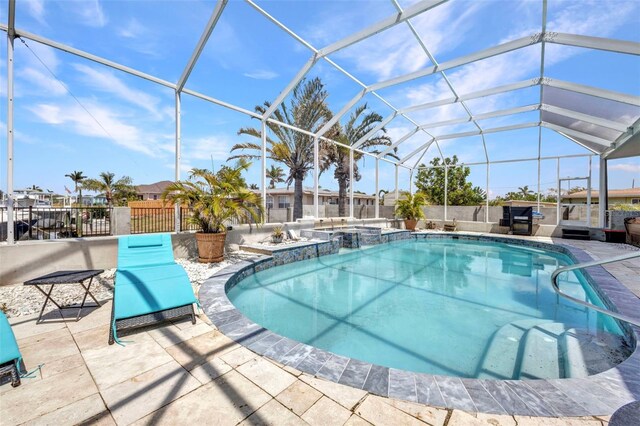 4213 Gardner Dr, Port Charlotte, FL 33952 - view of pool with a patio, glass enclosure, and a pool with connected hot tub