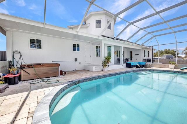 4213 Gardner Dr, Port Charlotte, FL 33952 - back of house featuring a hot tub, a patio area, glass enclosure, and stucco siding