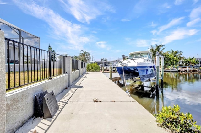 4213 Gardner Dr, Port Charlotte, FL 33952 - dock area featuring boat lift, a water view, and glass enclosure