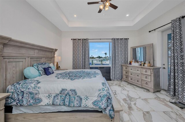 4213 Gardner Dr, Port Charlotte, FL 33952 - bedroom with a tray ceiling, a ceiling fan, light marble finish floors, and recessed lighting