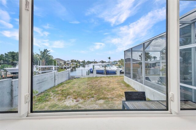 4213 Gardner Dr, Port Charlotte, FL 33952 - view of grassy yard with a water view and glass enclosure