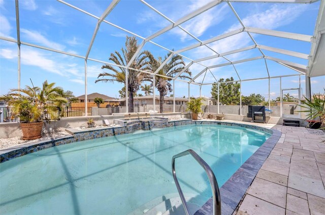 4213 Gardner Dr, Port Charlotte, FL 33952 - view of pool with a patio, a lanai, a pool with connected hot tub, and a fenced backyard
