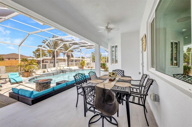 4213 Gardner Dr, Port Charlotte, FL 33952 - view of patio with an outdoor fire pit, a ceiling fan, and a lanai