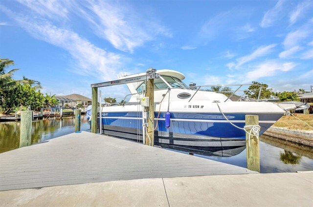 4213 Gardner Dr, Port Charlotte, FL 33952 - dock with a water view and boat lift