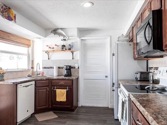 582 Ridgewood St NW, Port Charlotte, FL 33952 - kitchen with white appliances, a sink, a textured ceiling, dark wood finished floors, and decorative backsplash