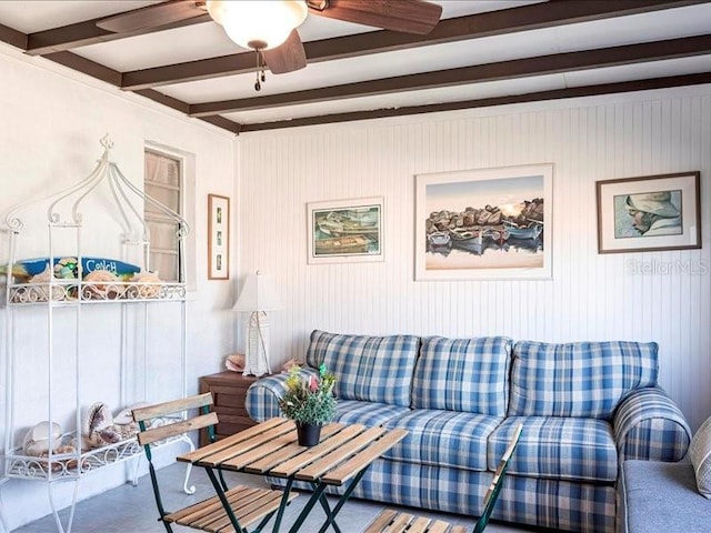 582 Ridgewood St NW, Port Charlotte, FL 33952 - living room featuring beamed ceiling and ceiling fan