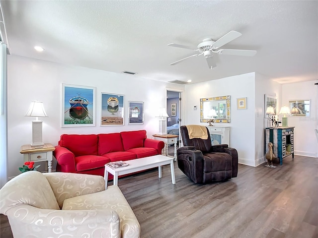 582 Ridgewood St NW, Port Charlotte, FL 33952 - living room with wood finished floors, ceiling fan, a textured ceiling, recessed lighting, and baseboards