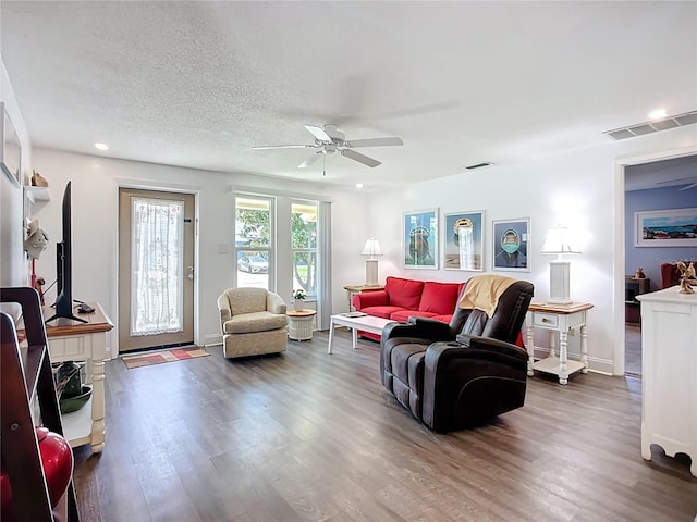 582 Ridgewood St NW, Port Charlotte, FL 33952 - living area featuring ceiling fan, dark wood-style flooring, recessed lighting, and baseboards