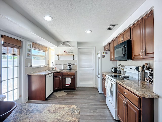 582 Ridgewood St NW, Port Charlotte, FL 33952 - kitchen featuring black microwave, electric range, dishwasher, a sink, and a textured ceiling