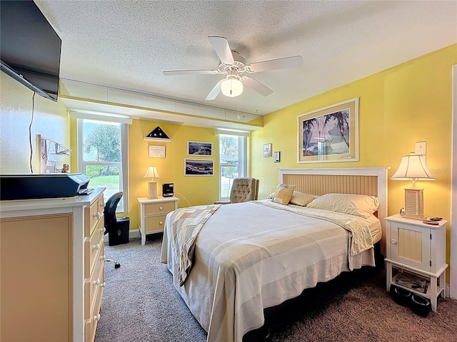 582 Ridgewood St NW, Port Charlotte, FL 33952 - carpeted bedroom with a textured ceiling and a ceiling fan