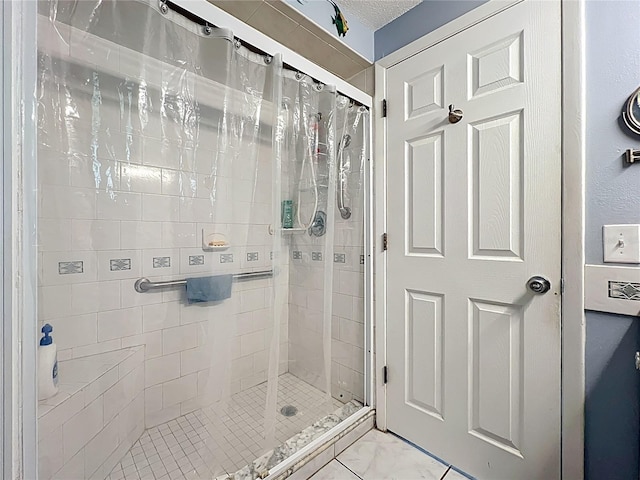 582 Ridgewood St NW, Port Charlotte, FL 33952 - bathroom featuring a shower stall and marble finish floors