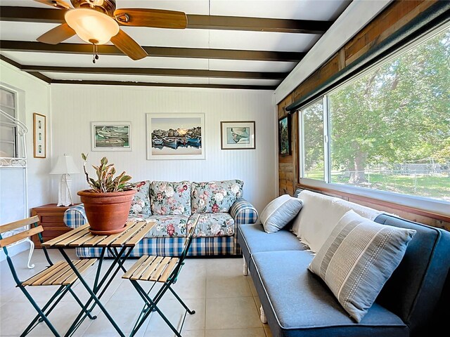 582 Ridgewood St NW, Port Charlotte, FL 33952 - living room featuring plenty of natural light, beam ceiling, light tile patterned floors, and ceiling fan