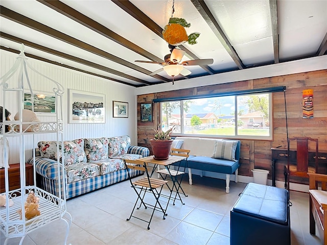 582 Ridgewood St NW, Port Charlotte, FL 33952 - tiled living area with a ceiling fan, wood walls, and beamed ceiling