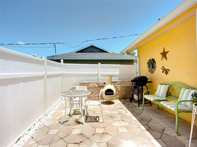 582 Ridgewood St NW, Port Charlotte, FL 33952 - fenced backyard with a patio area and a grill
