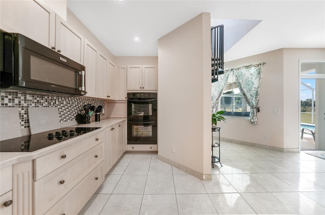 kitchen with black appliances, tasteful backsplash, light tile patterned flooring, baseboards, and recessed lighting