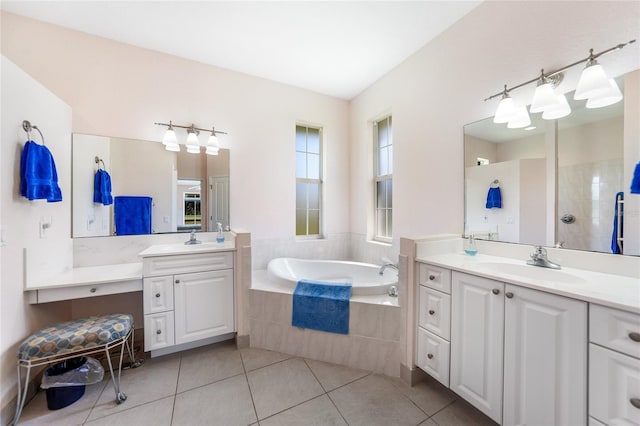 full bathroom featuring a garden tub, tile patterned flooring, two vanities, and a tile shower
