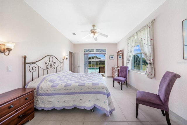 tiled bedroom with access to outside and a ceiling fan
