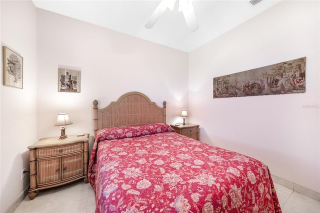 bedroom with light tile patterned floors, baseboards, and ceiling fan