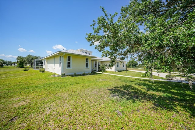 bungalow with a front yard and metal roof