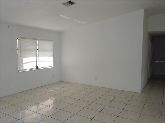 582 Reading St NW, Port Charlotte, FL 33952 - spare room featuring light tile patterned flooring