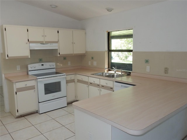 582 Reading St NW, Port Charlotte, FL 33952 - kitchen featuring white appliances, under cabinet range hood, decorative backsplash, a peninsula, and light countertops