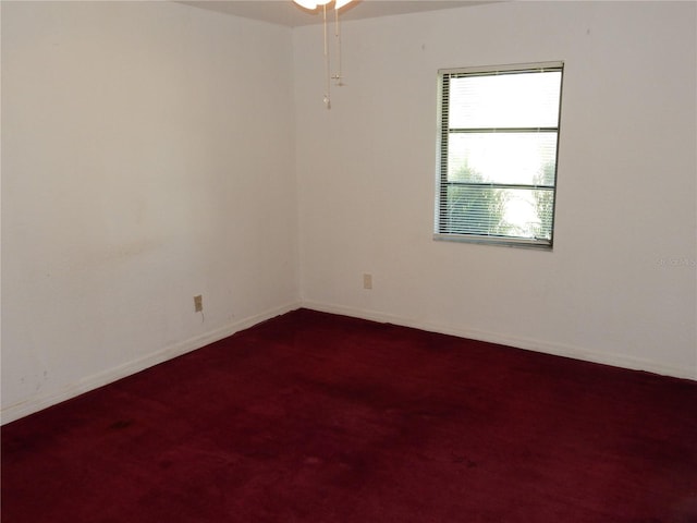 582 Reading St NW, Port Charlotte, FL 33952 - spare room with baseboards and dark carpet