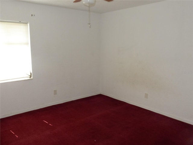582 Reading St NW, Port Charlotte, FL 33952 - unfurnished room featuring a ceiling fan and dark carpet