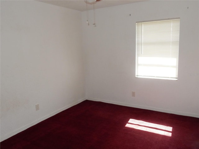 582 Reading St NW, Port Charlotte, FL 33952 - spare room with dark carpet and a ceiling fan