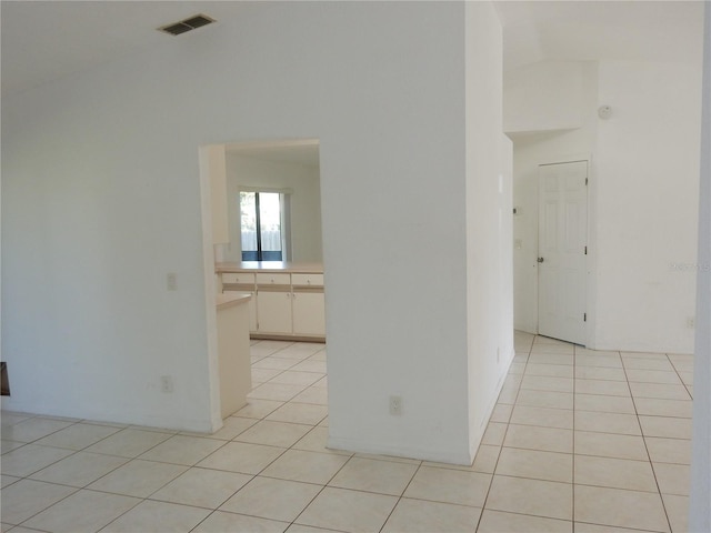 582 Reading St NW, Port Charlotte, FL 33952 - unfurnished room with light tile patterned floors and high vaulted ceiling