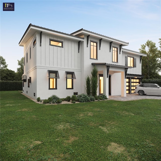 2560 Baybreeze St, Saint James City, FL 33956 - modern inspired farmhouse featuring an attached garage, a front lawn, board and batten siding, and stucco siding