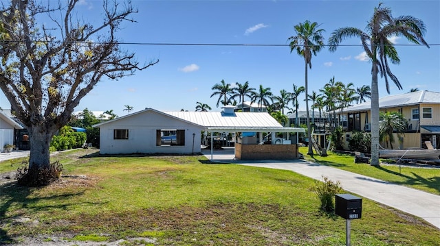 2560 Baybreeze St, Saint James City, FL 33956 - ranch-style home with a front yard and concrete driveway