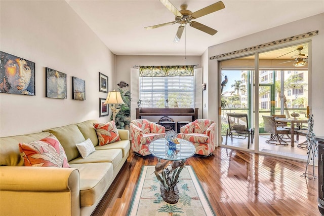 living area featuring ceiling fan and hardwood / wood-style flooring