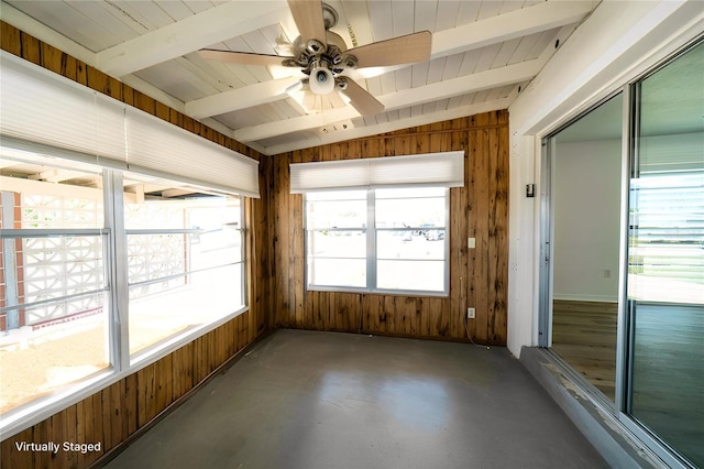 unfurnished sunroom with beam ceiling