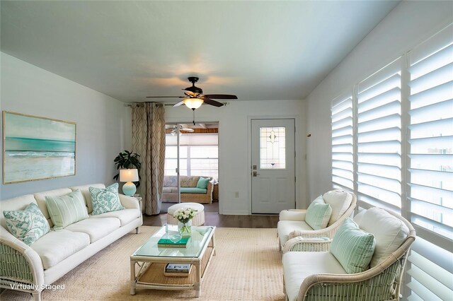 living room featuring wood finished floors and ceiling fan