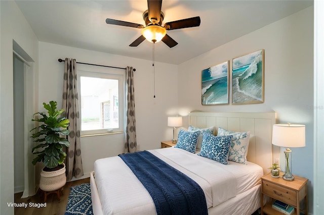 bedroom featuring wood finished floors and ceiling fan