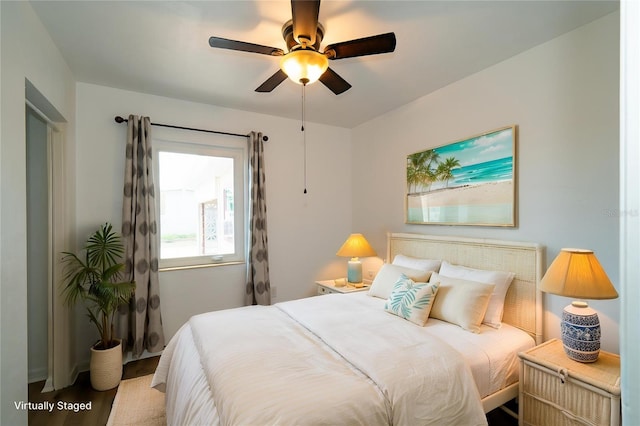 bedroom featuring wood finished floors and ceiling fan