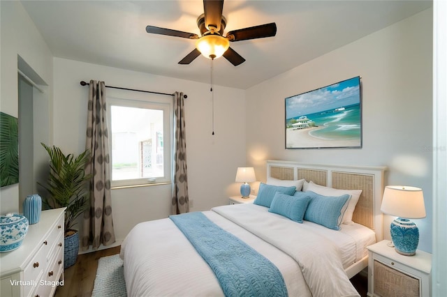 bedroom featuring wood finished floors and ceiling fan