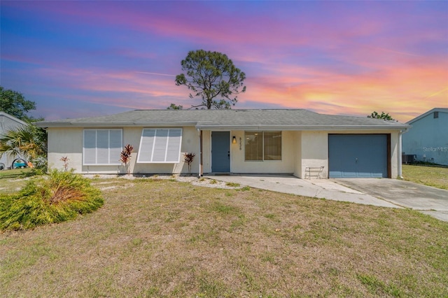 8238 San Jacinto Ave, North Port, FL 34287 - single story home with concrete driveway, a front lawn, stucco siding, and a garage