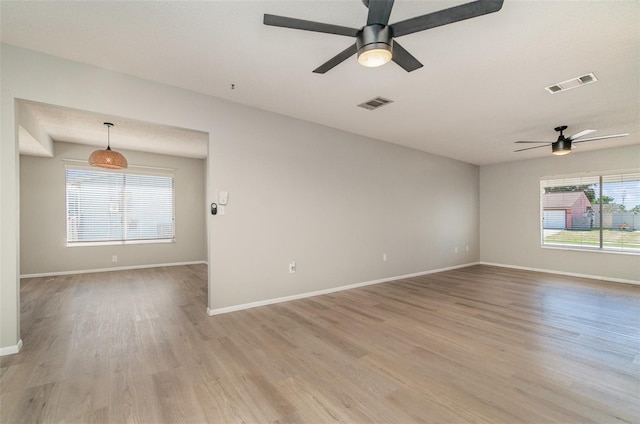 8238 San Jacinto Ave, North Port, FL 34287 - unfurnished room featuring baseboards, a ceiling fan, visible vents, and light wood-style floors