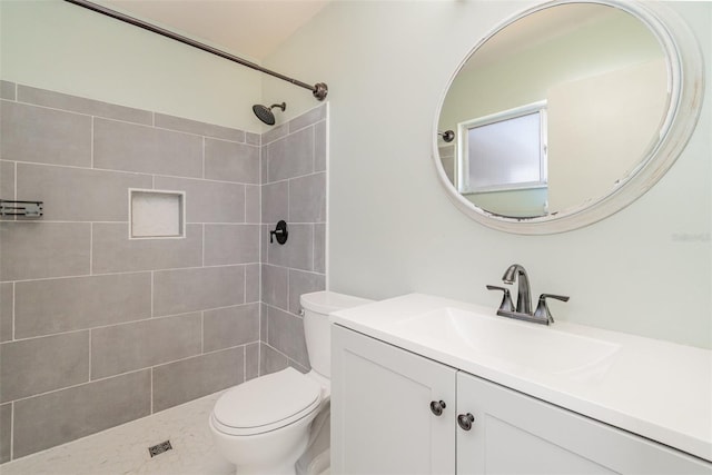 8238 San Jacinto Ave, North Port, FL 34287 - bathroom featuring a tile shower, toilet, and vanity