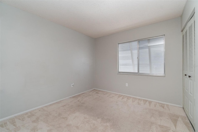 8238 San Jacinto Ave, North Port, FL 34287 - unfurnished bedroom featuring baseboards, carpet, and a closet