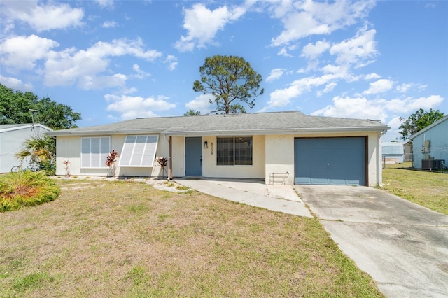 8238 San Jacinto Ave, North Port, FL 34287 - ranch-style home featuring central air condition unit, driveway, a garage, a front yard, and stucco siding